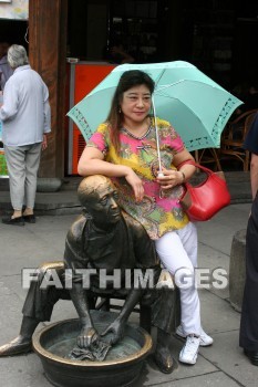 chinese woman, umbrella, statue of man with washtub, hangzhou, china, umbrellas